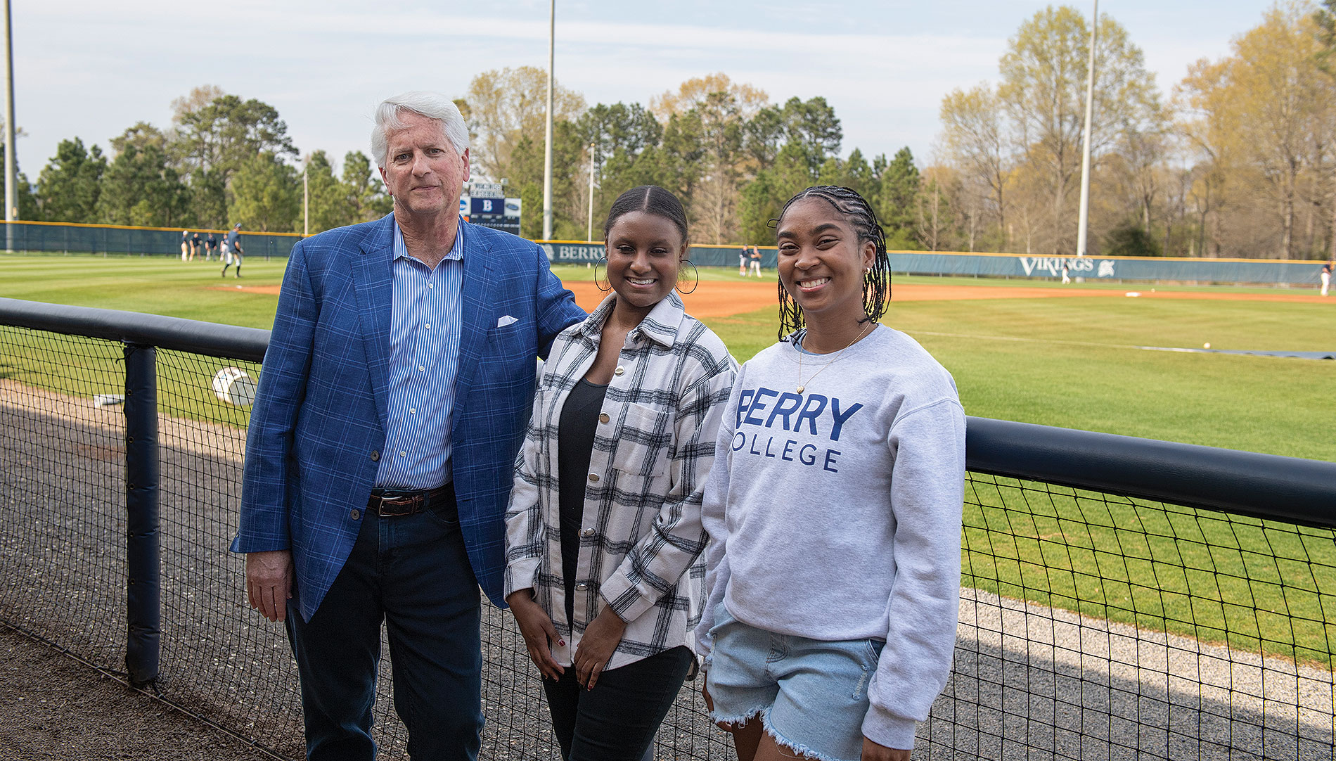 Berry Trustee Roger Lusby (79C), left, with students Ary Flowers and Nurah Williams, both of whom have benefited from scholarships he funded with wife Candy Caudill Lusby (82c) honoring baseball heroes from his childhood, Hank Aaron (Flowers) and Roberto Clemente (Williams).