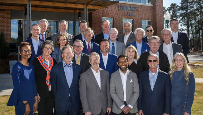 Steve Briggs with members of the Board of Trustees and new President Sandeep Mazumder