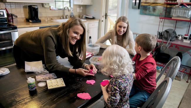 Taylor Worland playing with children