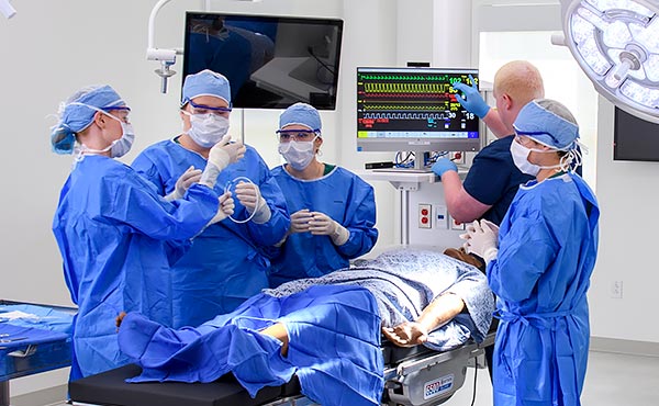 Students in a mock operating room at Morgan-Bailey Hall.