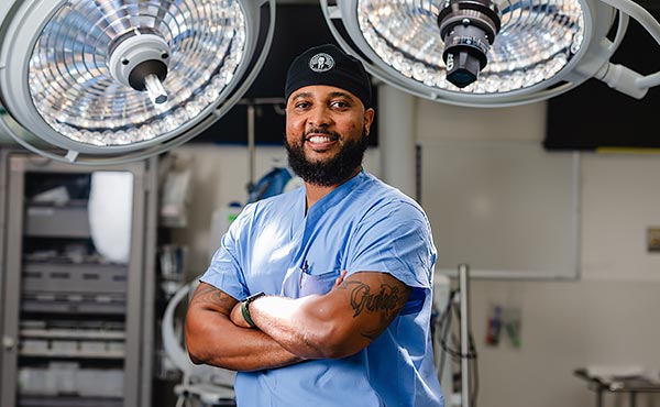 President Mazumder against a background of blue bokeh lights