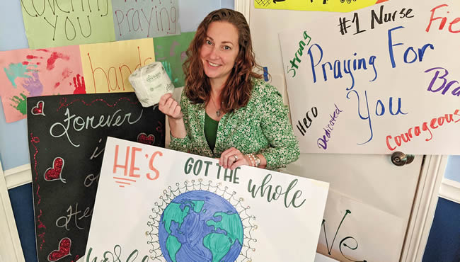 Woman surrounded by colorful posters