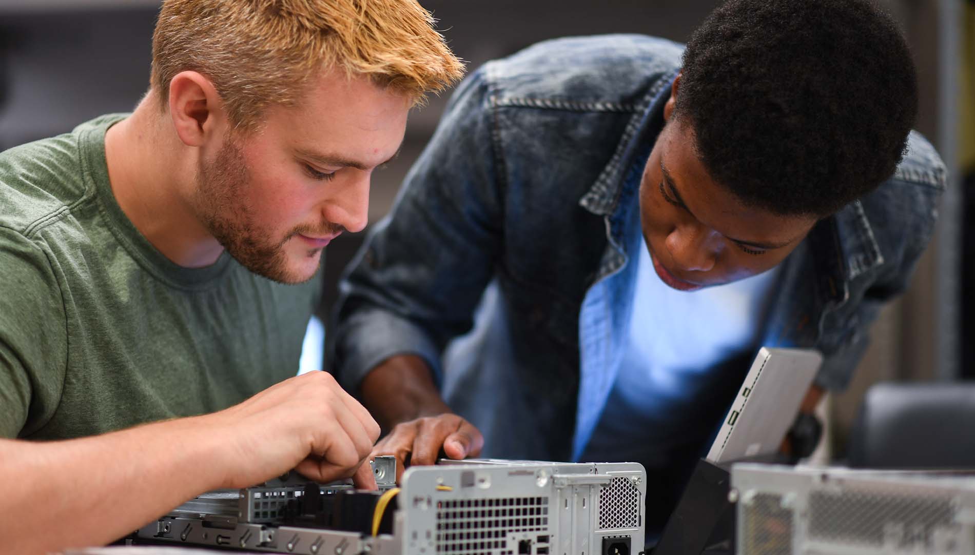 two students working on a computer