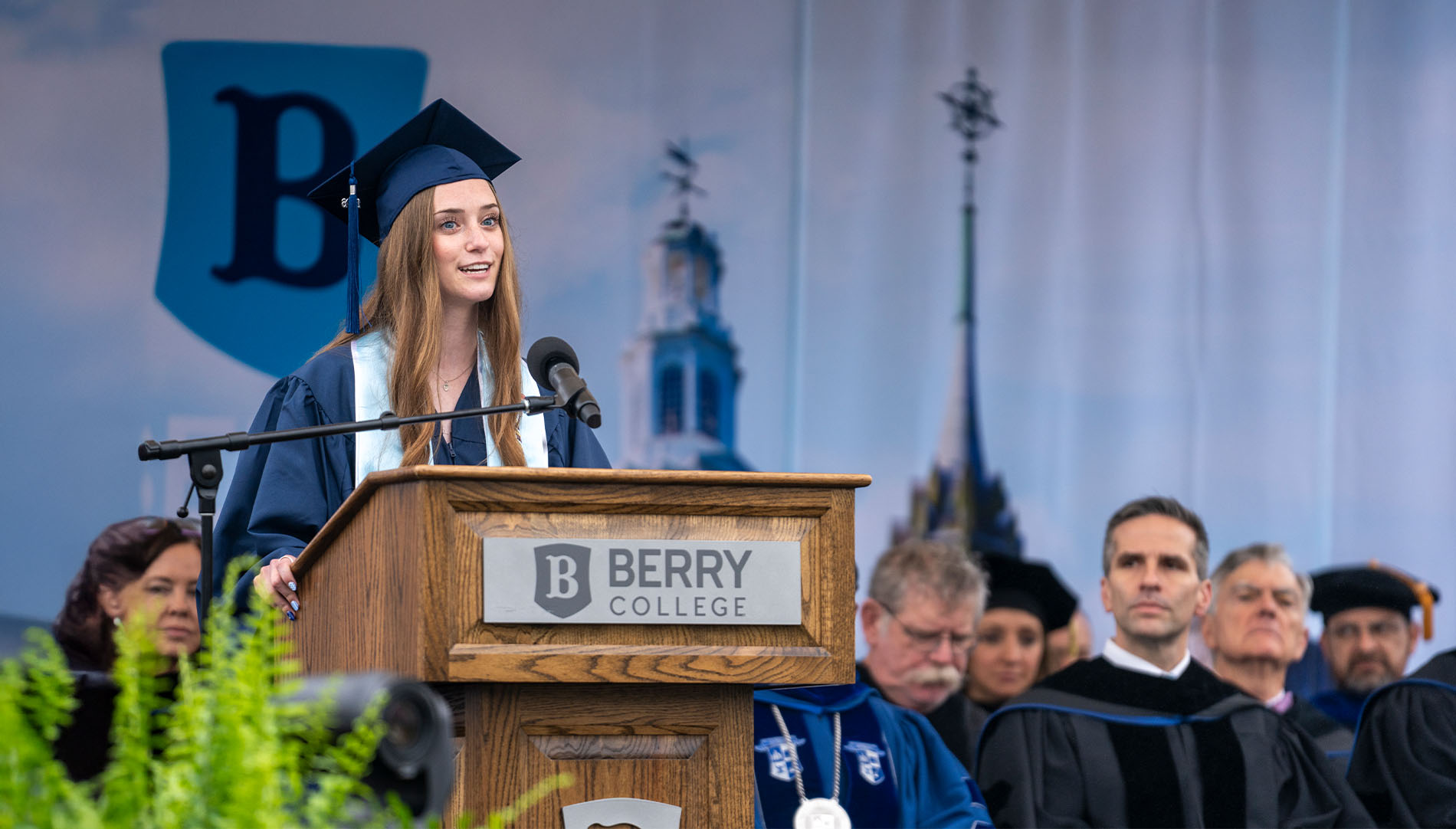 Graduating senior Sydney Summers addresses the crowd at a podium