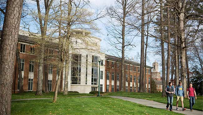 Students walking outside of the MAC building