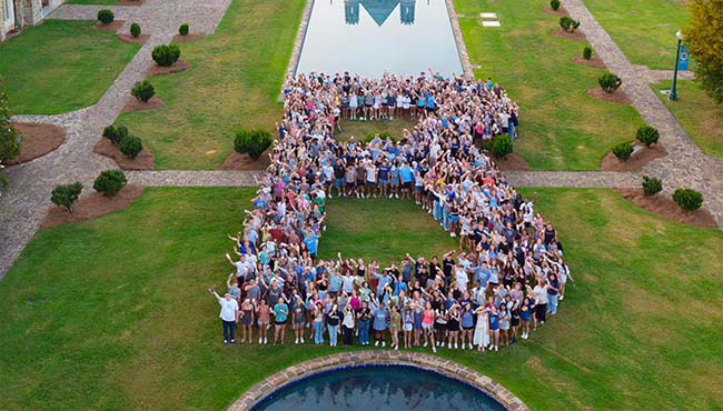 Class of 2030 standing in a shape of the letter B