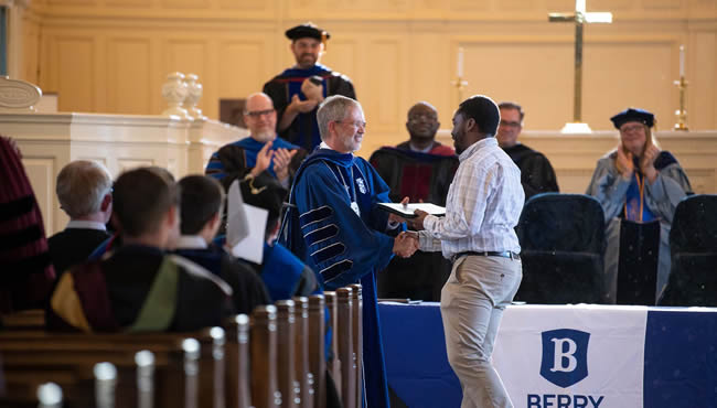 Steve Briggs presents staff with award