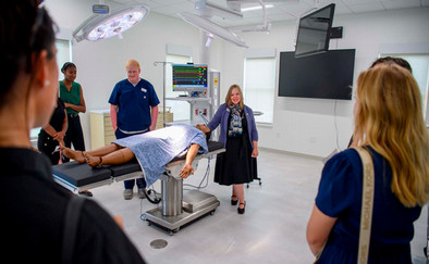 Faculty, students and stakeholders in the Morgan-Bailey Hall Operating Room