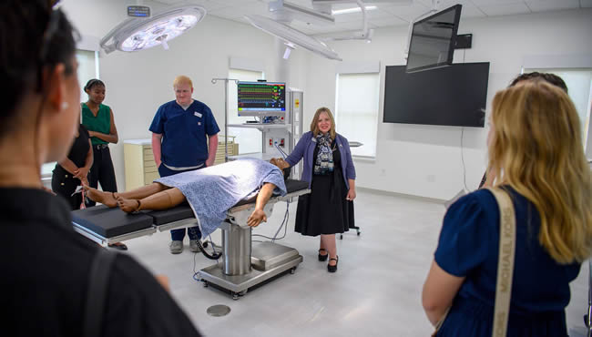 Faculty, students and stakeholders in the Morgan-Bailey Hall Operating Room