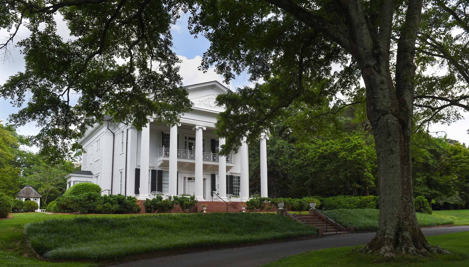Oak Hill building surrounded by green trees