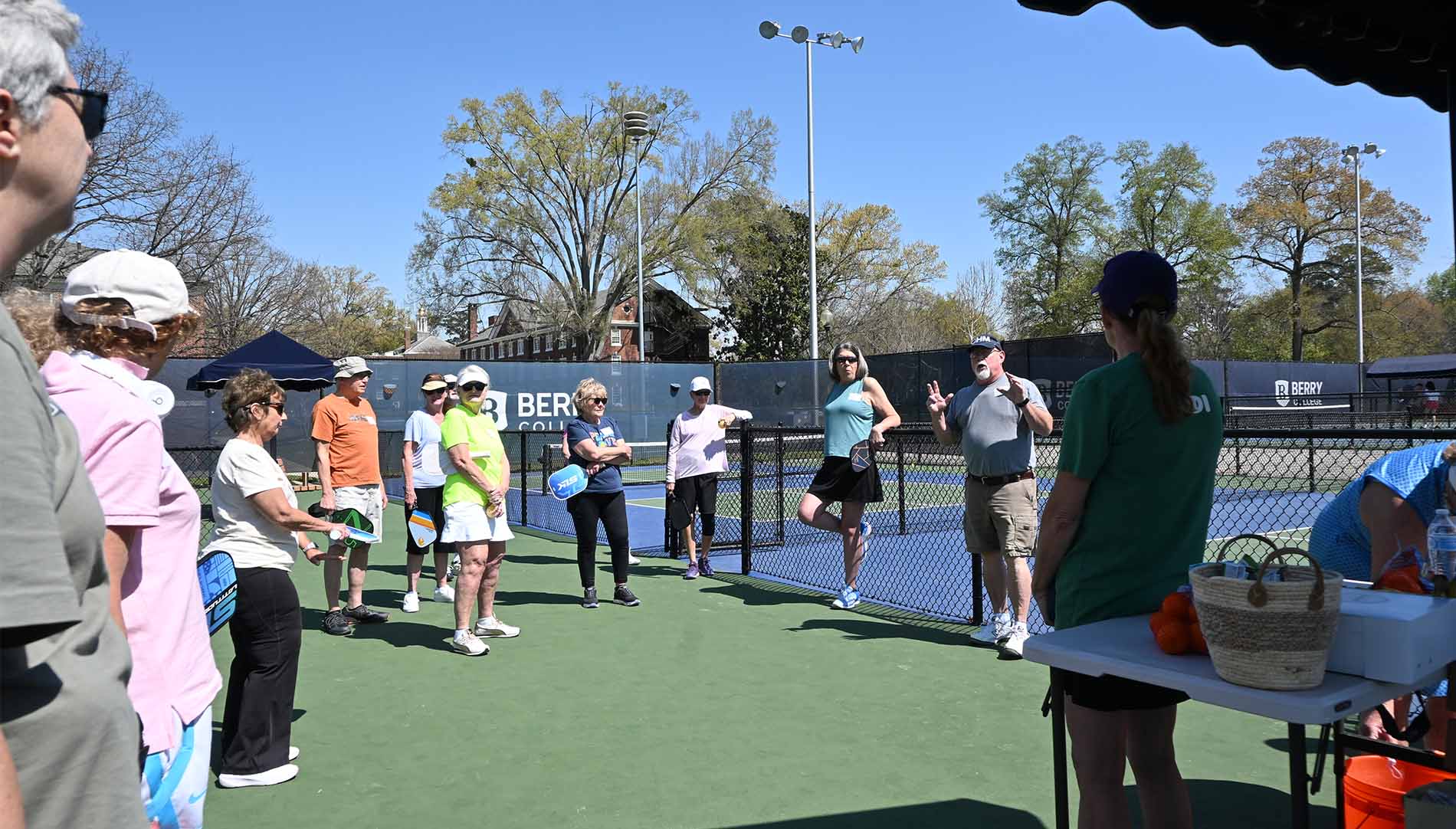 Group of senior scholars grouped together on a pickleball court
