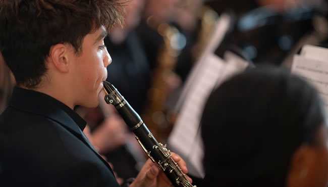 Student playing an instrument