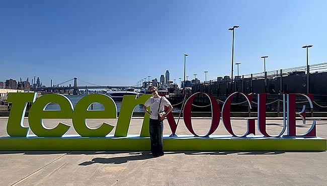 Audrey Bennett in front of the Teen Vogue sign in New York