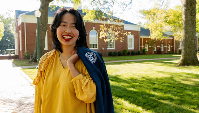 Graduate outside on campus