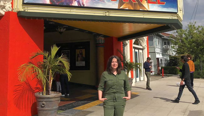 Hannah Greene in front of a theatre