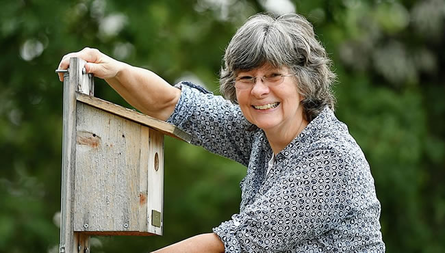 Renee Carleton and a birdhouse